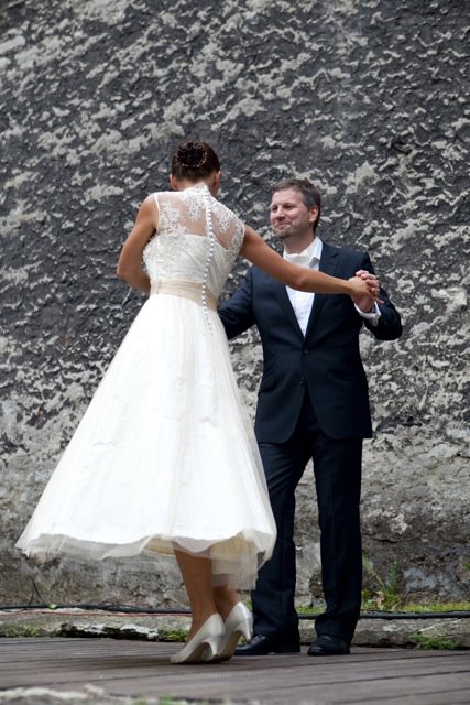 Bride and groom dancing, showing the movement of the bridal gown