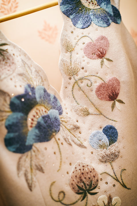 Close view of floral embroidery on an Amanjeda bridal gown