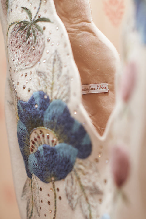 Close view of the embroidered bridal gown neckline and lining