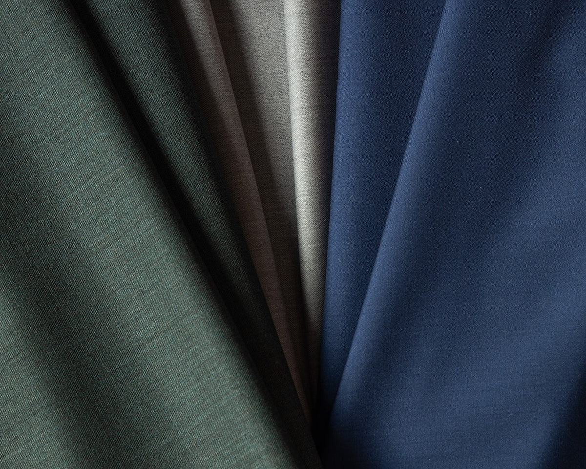 Layered Loro Piana Uniti fabrics in solid shades